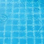 Rain drops on the swimming pool.